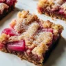 Delicious homemade 3-ingredient rhubarb squares on a rustic table