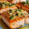 Delicious air fryer garlic butter salmon garnished with herbs on a plate