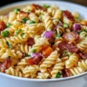 Bacon Ranch Pasta Salad in a bowl with fresh ingredients