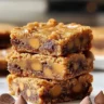 Deliciously sweet Butterscotch Toffee Cookie Bars placed on a wooden table