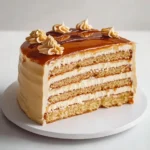 Delicious Caramel Cream Layer Cake with creamy frosting and caramel drizzle