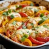Cheesy baked fajita chicken with vibrant peppers and melted cheese
