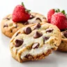 Freshly baked chocolate chip cookies on a cooling rack