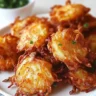 Crispy Amish onion fritters served on a plate, perfect for snacking.
