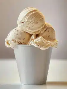 Dr. Pepper Ice Cream 4 A scoop of Dr. Pepper ice cream topped with chocolate syrup and cherries