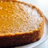 Slice of Grandma's Famous Sweet Potato Butter Cake on a rustic wooden table