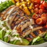 Delicious Grilled Chicken & Avocado Salad Bowl with colorful ingredients