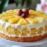 Delicious slice of Juicy Pineapple Heaven Cake topped with fresh pineapple