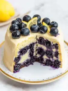 Lemon blueberry cake with fresh blueberries and lemon zest decoration