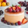 Sliced sangria soaked sponge cake garnished with fresh fruit