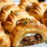 Savory sausage cream cheese crescents on a serving platter