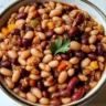 Bowl of delicious slow cooker cowboy beans with spices