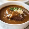 Delicious brown gravy without drippings served on a plate with mashed potatoes
