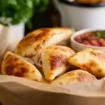 Crispy air fryer pizza rolls served on a plate.