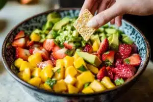 Colorful Avocado Strawberry Mango Salsa in a bowl, ready to serve.