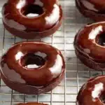 Delicious chocolate mini donuts arranged on a plate