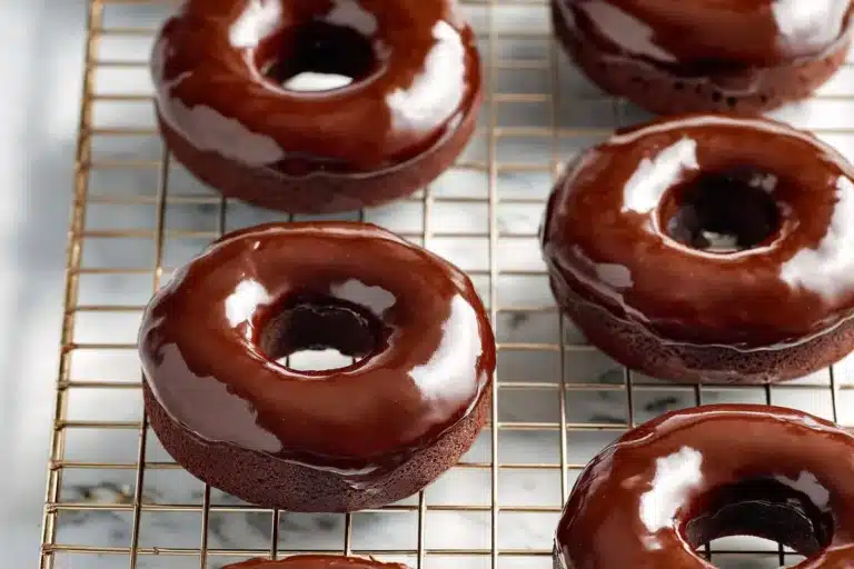 Delicious chocolate mini donuts arranged on a plate