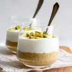 Bowl of pistachio overnight oats topped with nuts and fruits
