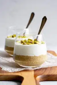 Bowl of pistachio overnight oats topped with nuts and fruits