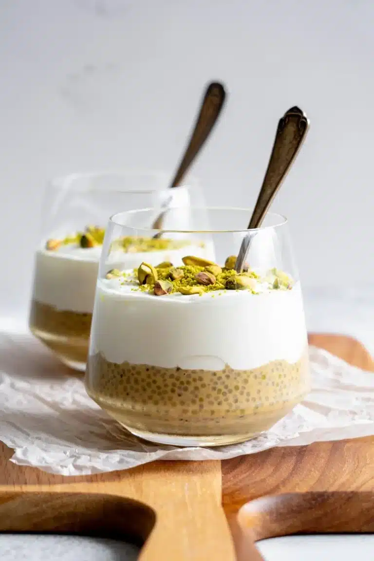 Bowl of pistachio overnight oats topped with nuts and fruits