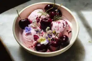 Strawberry Cheesecake Ice Cream: A Dreamy Delight That's Easy to Make 6 Creamy strawberry cheesecake ice cream served in a bowl with fresh strawberries