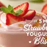 Delicious homemade strawberry frozen yogurt topped with fresh strawberries