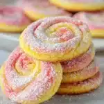 Fresh Strawberry Lemonade Cookies with bright pink icing and lemon zest