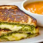Three Cheese Pesto Avocado Grilled Cheese Sandwich with melted cheese and fresh ingredients