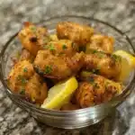 Delicious Garlic Butter Chicken Bites on a plate garnished with herbs