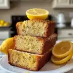 Freshly baked lemon poppy seed loaf on a wooden table