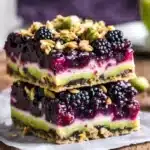 Delicious homemade Blackberry Pistachio Dream Bars ready to be served.