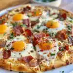 Delicious breakfast tortilla pizza topped with eggs and veggies