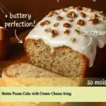 Butter Pecan Cake with Cream Cheese Icing beautifully decorated on a cake stand.