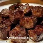 Crockpot steak bites simmering in a rich sauce