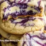 Blueberry cheesecake swirl cookies on a white plate