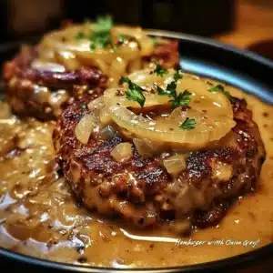 Delicious hamburger steaks served with flavorful onion gravy