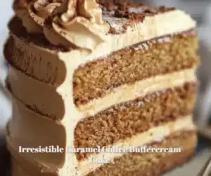 Delicious slice of caramel coffee buttercream cake topped with drizzled caramel.