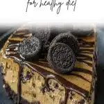 No Bake Oreo Peanut Butter Cheesecake topped with Oreo crumbles and peanut butter.