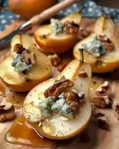 Walnut blue cheese honey pears elegantly arranged on a plate