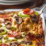 Delicious low carb pizza casserole served in a baking dish with fresh toppings.