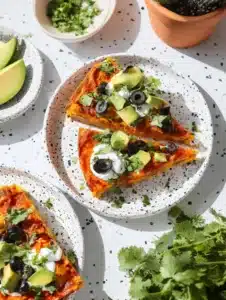 Delicious crustless taco pie served on a plate with toppings