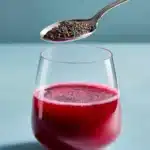 Healthy beetroot chia detox drink served in a glass with chia seeds and beetroot slices.