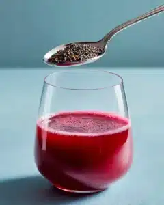 Beetroot Chia Detox Drink 3 Healthy beetroot chia detox drink served in a glass with chia seeds and beetroot slices.