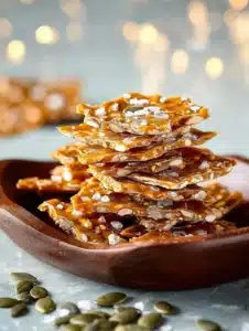 Delicious homemade pumpkin brittle in a decorative bowl