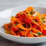 Delicious ribbon carrot salad served in a bowl with fresh ingredients