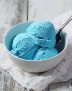 Blue Moon Ice Cream 6 A scoop of Blue Moon Ice Cream in a waffle cone topped with sprinkles