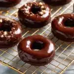 Delicious chocolate mini donuts stacked on a plate