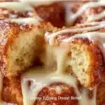 Slice of creamy Eggnog Donut Bread showcasing its rich texture and festive flavor