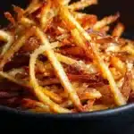 Crispy homemade shoestring French fries ready to enjoy