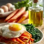 Plate of flavorful Korean Fried Noodles with vegetables and spices